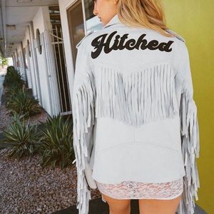 “Hitched” white leather fringe jacket
